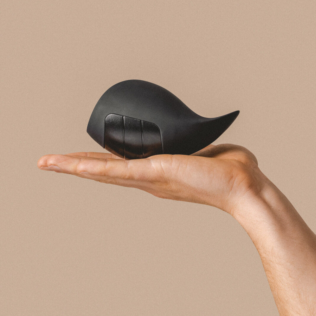 Vibrating male masturbator on hand